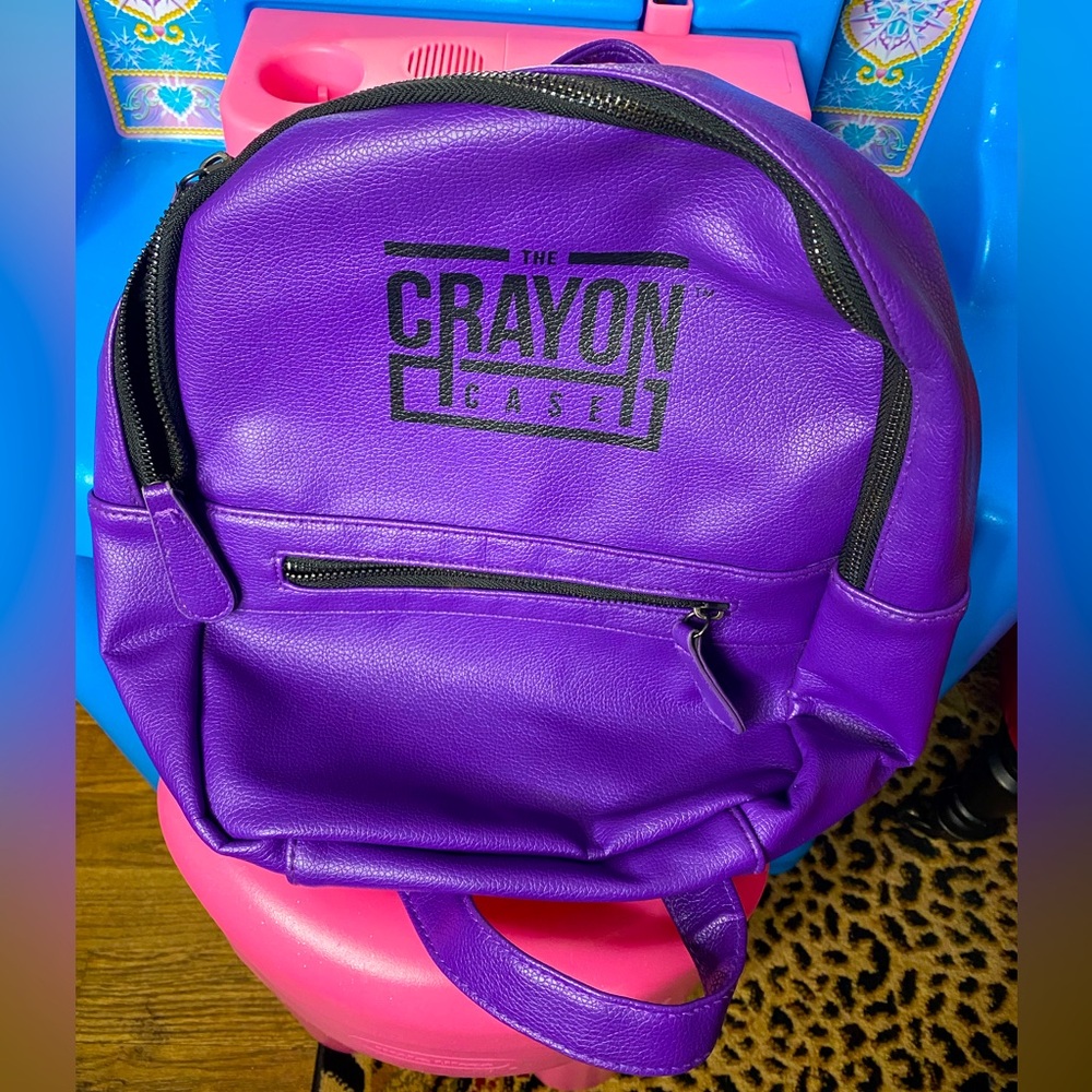 The crayon case purple backpack